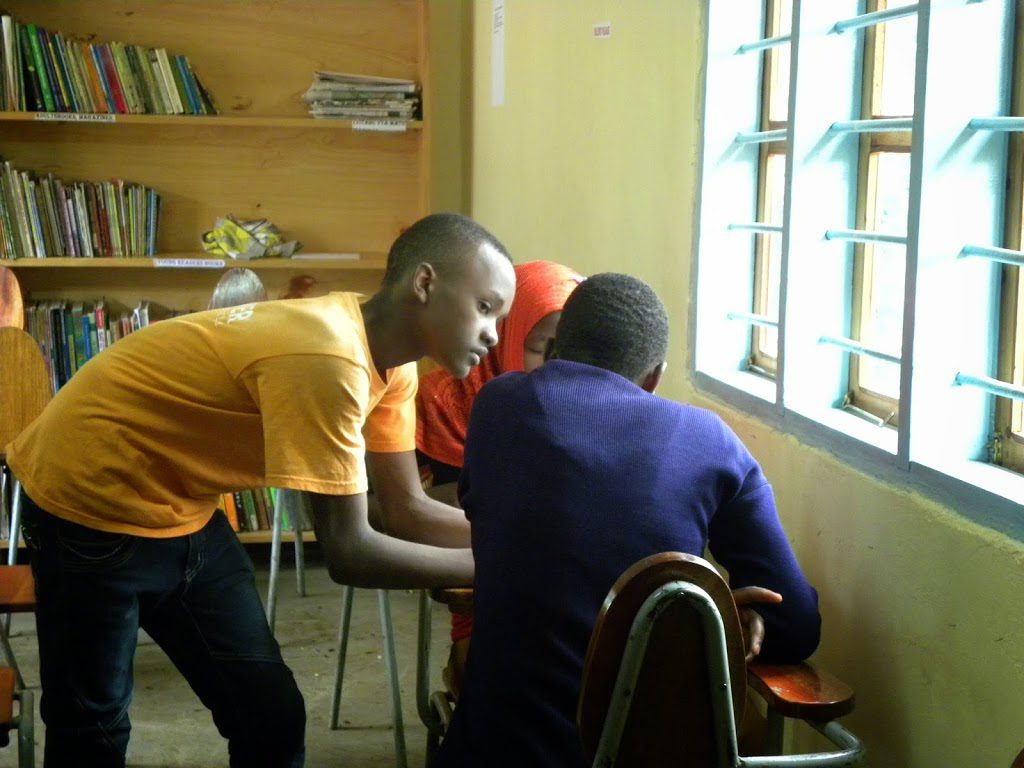 Two men are playing a game in the room.