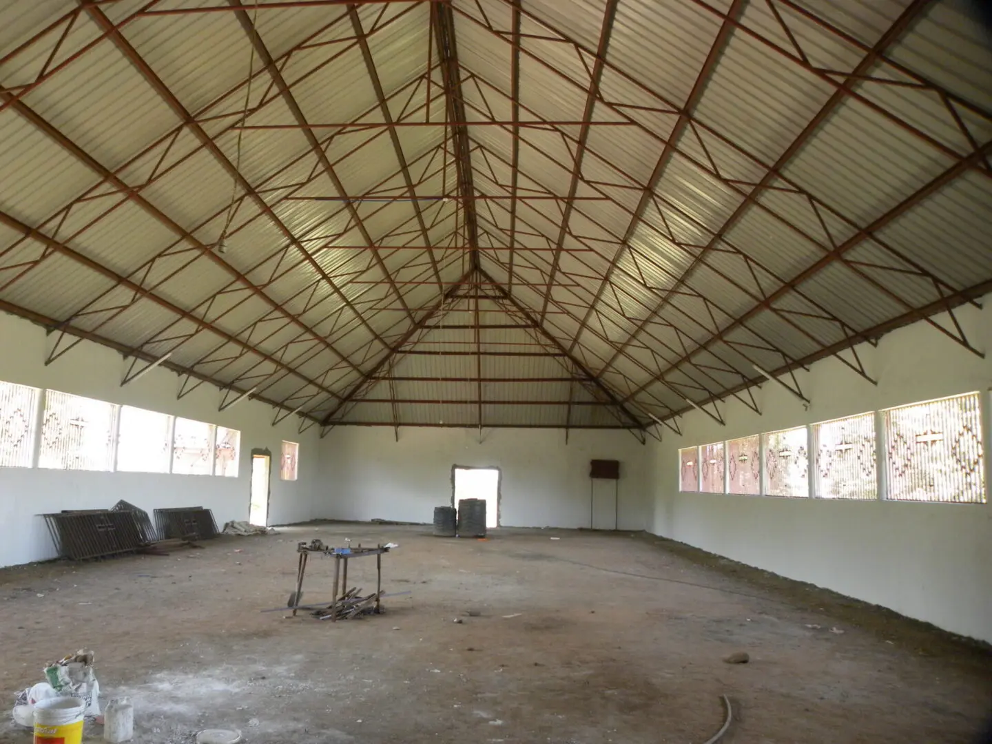 A large room with a lot of windows and chairs