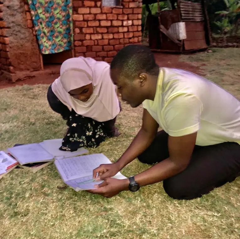 Two people studying together outdoors.