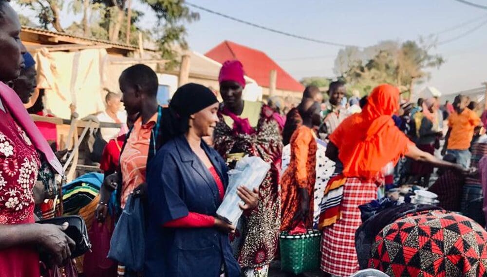 People shopping at a busy outdoor market.