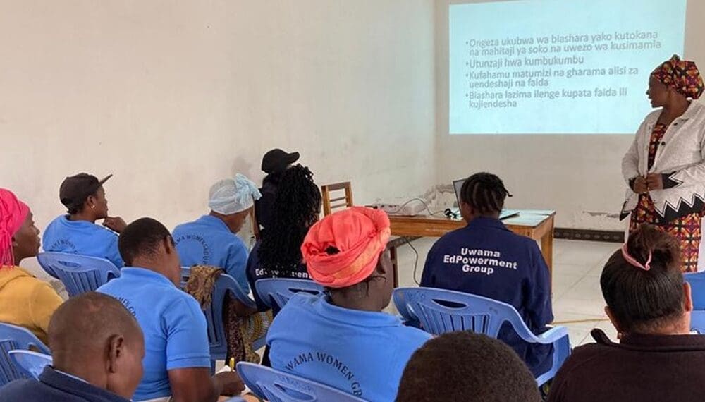Community workshop with participants and presenter speaking.