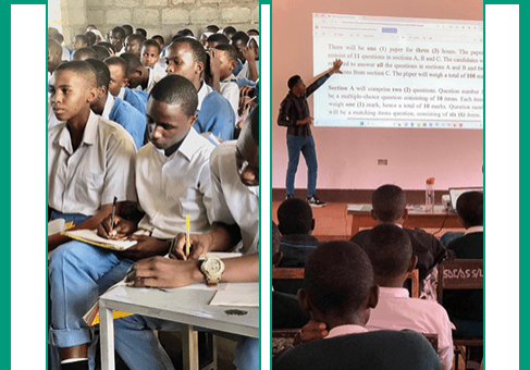 Students in a classroom taking an exam.